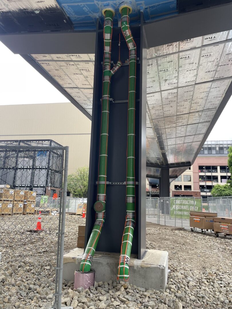 Green color pipes installed in a building
