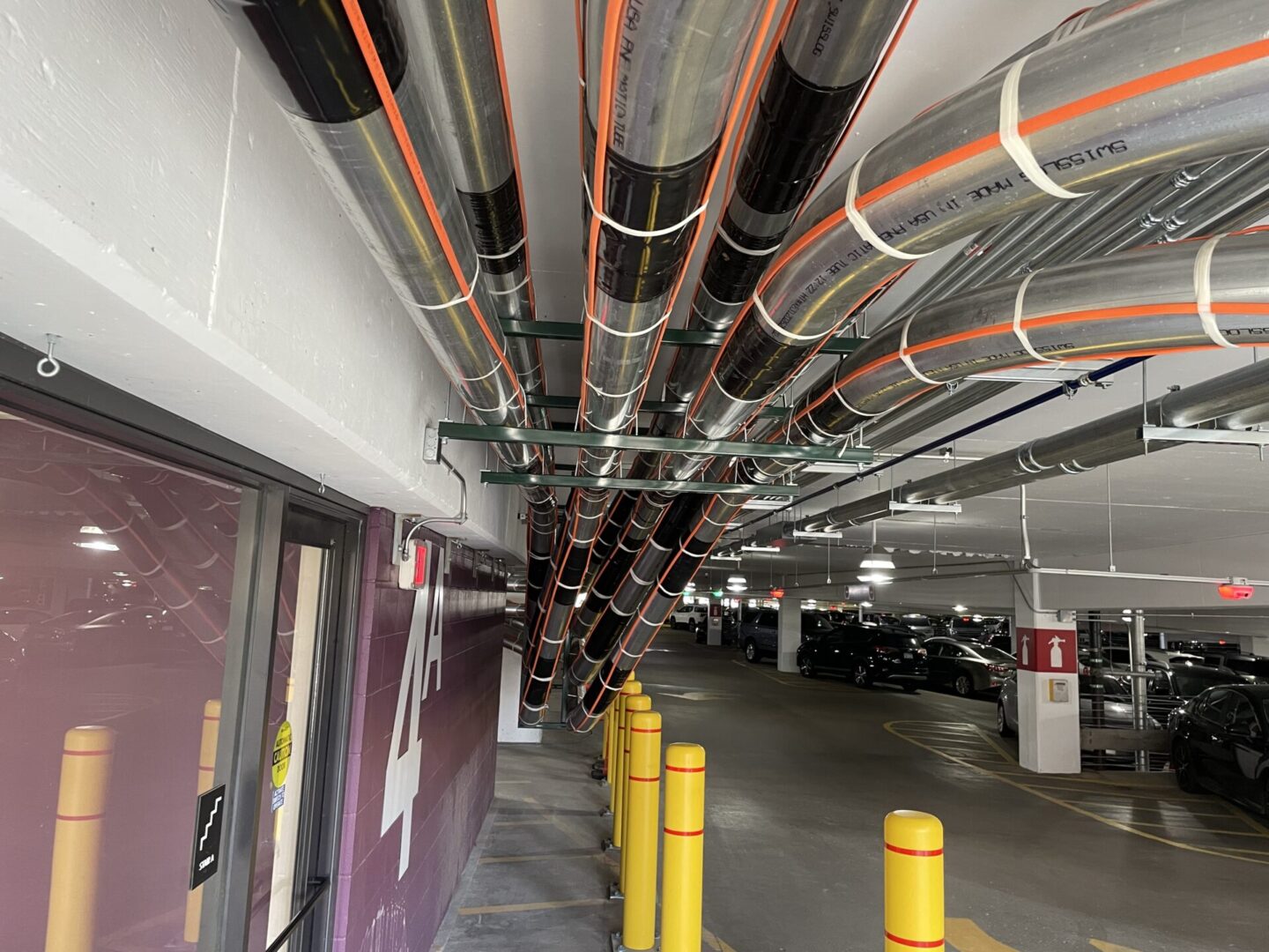 Multiple electrical pipes with orange tape